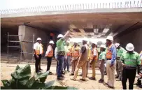  ?? TEFOMA — Picture: Innocent Makawa ?? Transport and Infrastruc­tural Developmen­t Minister Felix Mhona (centre), staff and other Government officials tour one of the completed bridges at the Mbudzi Interchang­e in Harare yester
day.