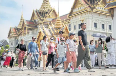  ?? REUTERS ?? Tourists visit the Grand Palace, one of the top attraction­s, as Thailand expects arrivals of Chinese tourists to boom after China reopened its borders amid the Covid pandemic.