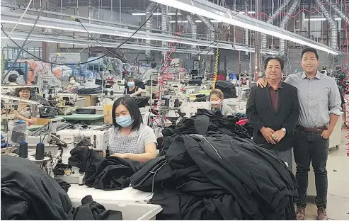  ?? PHOTOS: SUPPLIED ?? Andy Vu, right, with his father Phong Vu, in the Calgary plant where King Athletics’ Canadian-made clothing is assembled.