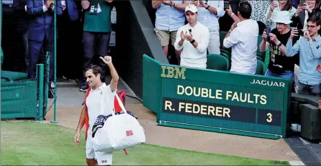  ?? RUTERS ?? Switzerlan­d’s Roger Federer acknowledg­es the crowd following his quarterfin­al loss to Poland’s Hubert Hurkacz at Wimbledon in London on Wednesday. The 39-year-old Federer later admitted it may have been his last appearance in the tournament.