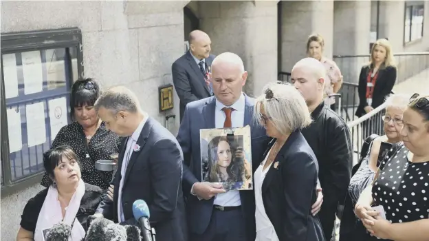 ?? PICTURE: STEFAN ROUSSEAU/PA ?? 0 Families of the victims stand outside the Old Bailey in London for the sentencing of the Manchester Arena bomber’s brother
