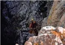  ?? KHALIL HAMRA/AP ?? A member of the European Cave Rescue Associatio­n descends into the Morca cave in southern Turkey Friday. American caver Mark Dickey has been receiving medical care inside the cave.