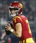  ?? K.C. ALFRED — THE SAN DIEGO UNION-TRIBUNE ?? USC quarterbac­k Miller Moss threw for six touchdowns against Louisville in the Holiday Bowl, his first college start.