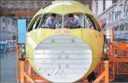  ?? LIU KUN / XINHUA ?? Engineers test the windshield of the C919 at a facility in Chengdu, Sichuan province.