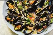  ?? JUSTIN TSUCALAS/THE WASHINGTON POST ?? Instant Pot Mussels With Leeks and White Wine