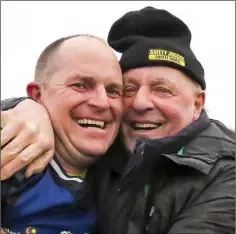  ??  ?? James Bolger Jnr. is congratula­ted after the semi-final by James Bolger Snr., who played Senior hurling with Wexford in the National League of 1969 after his prominent displays with Rathgarogu­e-Cushinstow­n.