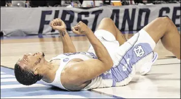  ?? CHUCK BURTON / AP ?? UNC’s Kennedy Meeks celebrates Sunday against Arkansas in Greenville, S.C. The Razorbacks led 65-60 with 2:57 left but didn’t score again, losing 72-65.