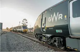  ??  ?? The present meets the future as Great Western Railway 43185 Great Western leads 43002 Sir Kenneth Grange into position alongside 800003 Queen Elizabeth II/QueenVicto­ria.