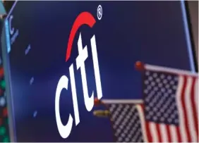  ?? AP FILE PHOTO/RICHARD DREW ?? The logo for Citigroup appears above a trading post at the New York Stock Exchange.