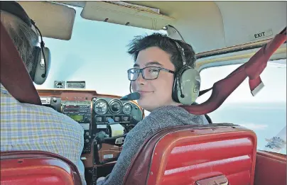  ?? DESIREE ANSTEY/ JOURNAL PIONEER ?? Cole Sinclair, 14, of Wellington, grins from ear to ear as he takes control of the small C-GDZA aircraft, under the watchful guidance of his instructor Dave Thomas, and learns how to fly.