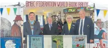  ?? ?? Between the book characters are Halton Mayor Coun Christophe­r Rowe, rally director Steve Hughes, FBCC chairperso­n Phyllis Greenough and her husband Barry.