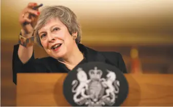  ?? WPA Pool / Getty Images ?? Prime Minister Theresa May’s chances of getting her deal through Parliament appeared to be shrinking. Her Conservati­ve government doesn’t have enough lawmakers to get a majority vote.