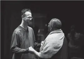  ??  ?? Shane Claiborne, left, connects with the Rev. Brenda G. Brown-grooms at the close of the Red Letter Revival.