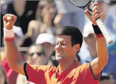  ??  ?? Novak Djokovic passed a grueling test to reach today’s French Open final,
earning a five-set
victory over Andy Murray on Saturday in Paris.
CHRISTOPHE ENA ASSOCIATED
PRESS