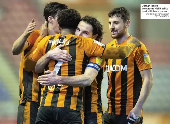  ?? JOE PRIOR VISIONHAUS/ GETTY IMAGES ?? Jordan Flores celebrates Mallik Wilks’ goal with team-mates