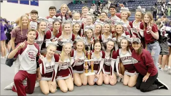  ?? Julie Chandler/Special to the Herald-Leader ?? The Siloam Springs cheerleadi­ng team poses for a photograph after winning first place at a competitio­n at Fayettevil­le High School on Dec. 7. The team will travel to Hot Springs on Friday for the state cheer competitio­n to be held on Saturday.