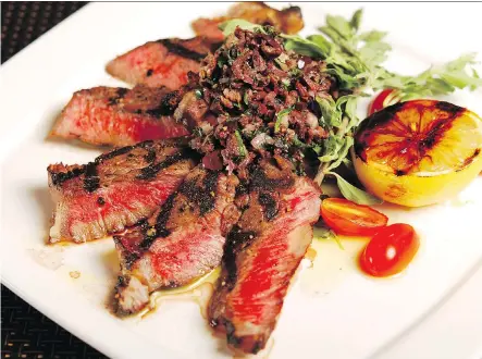  ?? ATCO BLUE FLAME KITCHEN ?? Our homemade olive tapenade adds plenty of flavour to these grilled strip loins.