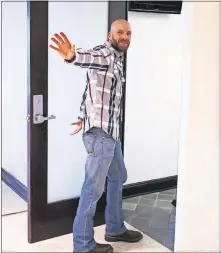  ?? [DOUG HOKE PHOTOS/THE OKLAHOMAN] ?? Michael Behenna waves as he enters an office after a news conference on Wednesday.