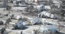  ?? Joe Raedle, Getty Images ?? Damaged homes and RVs at Sunshine Key RV Resort & Marina in Sunshine Key, Fla., lie in the wake of Hurricane Irma on Wednesday.