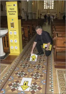  ??  ?? Fr. John Carroll marking out the floor of Barntown Church.