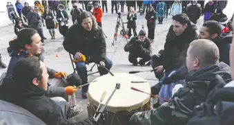  ?? JEAN LEVAC ?? Idle No More protesters play the warrior drum on Parliament Hill in Ottawa in 2013. In this excerpt, Ali Abukar describes connection to Indigenous peoples and what being a new Canadian means to him.