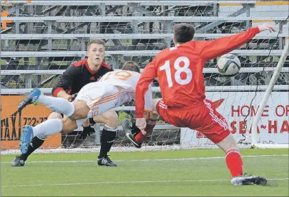  ?? KEITH GOSSE/THE TELEGRAM ?? Memorial University Sea-Hawks keeper David Hickey (left) moves to stop a diving header from the Cape Breton Capers’ Justin Maheu during the teams’ Atlantic University Sport men’s soccer match at King George V Park Sunday. At right is Sea-Hawks defender...