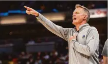  ?? Doug McSchooler / Associated Press ?? Warriors head coach Steve Kerr reacts to action on the court during a game against the Pacers in Indianapol­is on Dec. 13.