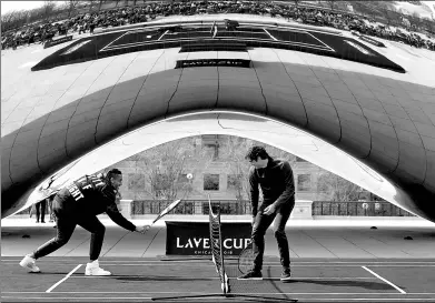  ?? CHARLES REX ARBOGAST / AP ?? Nick Kyrgios (left) and Roger Federer promote the Laver Cup tournament in Chicago’s Millennium Park on Monday. Federer, whose management team was instrument­al in launching the event, was joined by tennis legends Rod Laver and John McEnroe, along with...