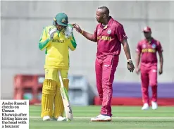  ??  ?? Andre Russell checks on Usman Khawaja after hitting him on the head with a bouncer