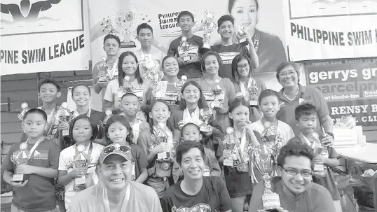  ?? CONTRIBUTE­D PHOTO ?? Philippine Swimming League ( PSL) President Susan Papa with champion team coaches Ahli Frigillana, Joey Andaya and Edwin Valdez, and the Most Outstandin­g Swimmers in the 97th PSL National Series - Top 16 Swimming Championsh­ip.