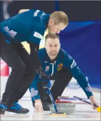  ?? The Canadian Press ?? Skip Brad Gushue looks down ice as lead Geoff Walker sweeps his shot during Olympic curling trials action on Monday in Ottawa. At right, skip Rachel Homan watches a shot approach the house during one of her two wins on Monday.