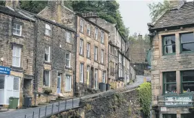  ??  ?? TELL SID: Cafe used in Last of the Summer Wine in the centre of Holmfirth; views of the centre of town and typically steep South Lane.