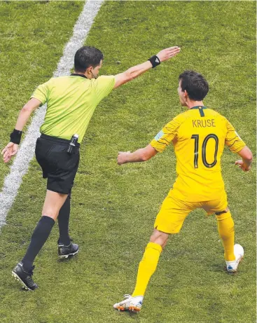  ?? Picture: GETTY IMAGES ?? MASSIVE CALL: Referee Andres Cunha awards a penalty after consulting a VAR review, as Australia’s Robbie Kruse protests during his side’s World Cup loss to France in Kazan, Russia.