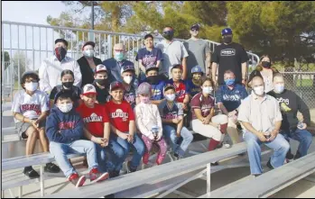  ?? COURTESY PHOTO ?? Players from the Palmdale Little League, league directors and league president Roger Villasenor are joined by Palmdale Mayor Steve Hofbauer, Mayor Pro Tem Laura Bettencour­t, Councilmem­ber Richard Loa and City Manager J.J. Murphy to celebrate the unveiling of new bleachers at the ballfields at Domenic Massari Park.