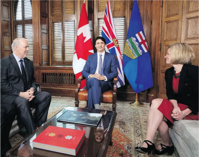  ?? JUSTIN TANG / THE CANADIAN PRESS FILES ?? B.C. Premier John Horgan, Prime Minister Justin Trudeau and Alberta Premier Rachel Notley meeting last Sunday to discuss the Trans Mountain pipeline.