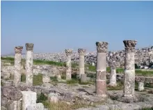  ??  ?? Photo shows ancient ruins on the monument-filled Citadel hill and, beyond, a panorama of Jordan's capital, Amman.