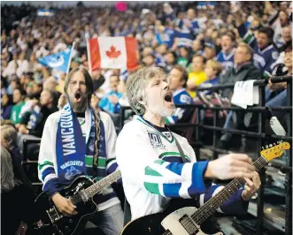  ?? RICK COLLINS/VANCOUVER CANUCKS ?? Murray Atkinson, left, and Craig Northey of the Vancouver power-pop band Odds. Northey goes back to 1992 with the Hip. He’s toured with them and he’s played hockey with them.