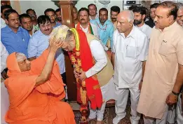  ?? — PTI ?? BJP chief Amit Shah visits the pontiff of Suttur Mutt ahead of Karnataka Assembly elections in Mysore on Friday.