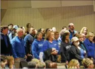  ??  ?? Members of the Coatesvill­e Area Teachers Associatio­n stand together during a Coatesvill­e Area School Board meeting Tuesday night.