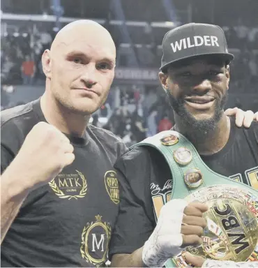  ?? PICTURE: PA ?? 0 Tyson Fury, left, and Deontay Wilder share a photo afterwards.
