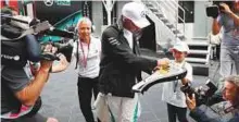  ?? Reuters ?? Mercedes’ Lewis Hamilton signs an autograph at the Austrian Grand Prix which was a debacle for him.