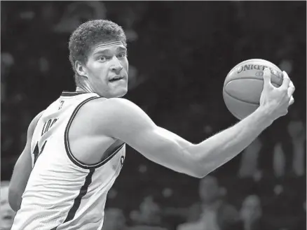  ?? Adam Hunger Associated Press ?? CENTER BROOK LOPEZ changed his style of play last season, taking 387 three-pointers for the Nets after attempting only 31 in his first eight NBA seasons. That should make the 7-footer a better fit in Luke Walton’s offense than Timofey Mozgov.