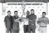  ??  ?? Tharindu Siriwarden­a, captain of Maliban Biscuits receiving the Champions Trophy from Kushan Hapuarachc­hi