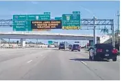  ?? WAYNE K. ROUSTAN/STAFF ?? Green highway signs and Dynamic Message Signs are springing up along Interstate 75 in Broward and MiamiDade counties as part of the 75 Express toll lanes project.