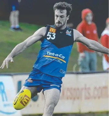  ??  ?? HE’S BACK: Eric Mackenzie, playing for East Perth, pumps the ball forward. Picture: DANIEL WILKINS