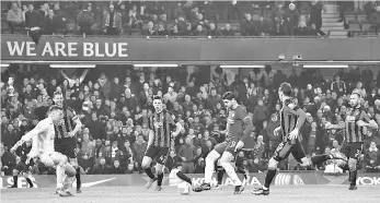  ??  ?? Chelsea’s Spanish striker Alvaro Morata (centre) scores the team’s second goal during the English League Cup quarter-final football match between Chelsea and Bournemout­h at Stamford Bridge Stadium, in southwest London on December 20, 2017. - AFP photo