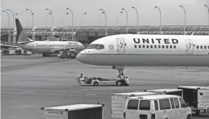  ?? ANTONIO PEREZ/CHICAGO TRIBUNE/TNS ?? United Airlines is giving customers who want to reduce the environmen­tal impact of their travel a way to buy sustainabl­e jet fuel that releases fewer emissions than traditiona­l jet fuel.