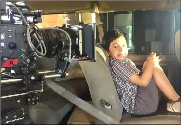  ?? COURTESY PHOTO ABBIE SOLAREZ ?? Jason Solarez, 7, of brawley sits in a van that will be filmed as part of a scene in the movie “Sound of Freedom,” which was shot over the weekend in Calexico at the old downtown port of entry, among other locations.