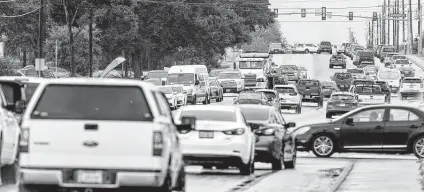  ?? William Luther / Staff photograph­er ?? Cars navigate the Culebra-Westwood Loop intersecti­on. Traffic in that area on the far West Side beyond Loop 1604 is a constant complaint. The arrival of new residents in the area has made it a magnet for traffic, chain stores, strip malls and new schools.