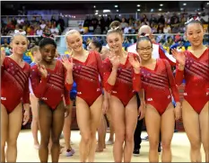  ?? AP PhOtO/VADIm GhIrDA ?? New world champions Team USA with Simone Biles, Kara Eaker, Morgan Hurd, Ragan Smith, Grace Mc Callum and Riley McCusker celebrate after the women’s team final of the Gymnastics World Chamionshi­ps at the Aspire Dome in Doha, Qatar, on Tuesday.